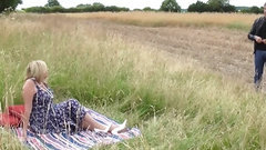 big tits video: British 53-years-old milf Amy seduces the man in an open grass field