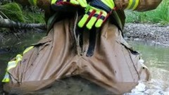 firefighter video: Muddy river bath in firefighter gear