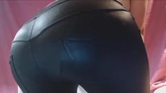 leather pants video: Cute girl in geek glasses farting in tight leather pants