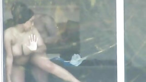 window video: Voyeur webcam front of hotel window screw