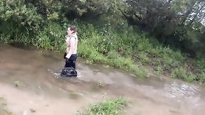mud video: gal has joy in the mud in a blue costume