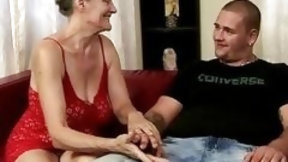 oldy video: Horny granny and young stud have passionate sex on sofa