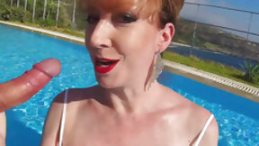 english video: British Mature Red XXX sucking cock in a pool