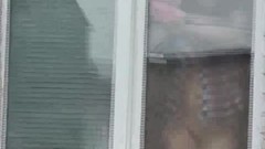 window video: Naked Step mom washes window son spies on mommy. Naked in public. Spying