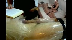 wrapped bondage video: Femdom Handjob Tease in Plastic Wrap While Reading