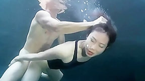 swimsuit video: swimsuit girl sex with a guy underwater
