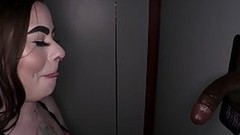 gloryhole video: Tattooed chick is eagerly sucking cock through a gloryhole, to make a random stranger cum