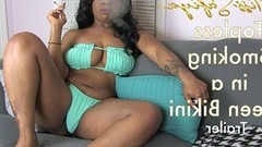 smoking video: Topless Smoking in a Green Bikini - Trailer