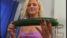 cucumber video: Slutty MILF is stretching her pussy with a massive cucumber
