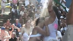 contest video: Partygoing chicks of all sizes bare their tits and asses in an outdoor wet T-shirt contest
