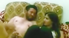 arab couple video: Arab slut fucks her husband in the living room, while a friend captures it.