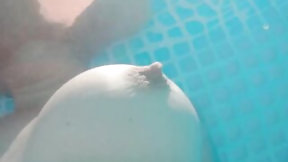 swimming video: Swimming around exposed in a garden pool with teasing