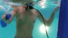 underwater video: Huge dildo face-fucking underwater