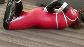 catsuit video: Red Latex Catsuit Girl Muzzled And Tied Up