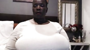 ebony bbw video: Black BBW is shaking her humongous tits in front of the camera