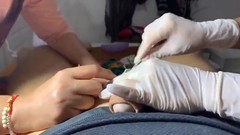wax video: Hot guy watches his cock waxed by two babes in gloves