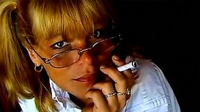 smoking fetish video: Cute smoking blonde in glasses