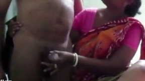 indian handjob video: Indian Aunty in a Saree Jerking Dick