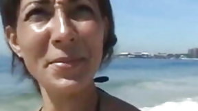 brazilian wife video: Tanned cougar was picked up on a public beach for kinky sex and a facial