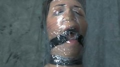 wrapped bondage video: Busty lady Sister Dee is all wrapped with cellophane food wrap