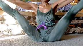 black video: Flexible girl is often doing her yoga routine in front of the camera, just for fun