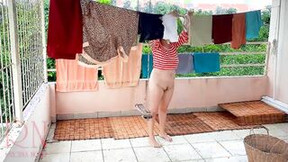 outdoor video: Nude laundry. The maid is drying clothes inside the laundry.