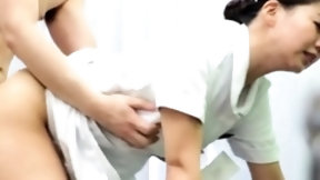 japanese massage video: Tiny uniform Japanese masseuse gives a sensual handjob