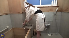 asian video: Japanese housemaid Hitomi Akiyama gives a handjob in the bathroom