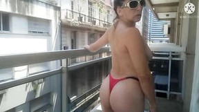argentinian video: Angeles Ariana makes toples on the balcony. Who slips sunscreen on my tail?