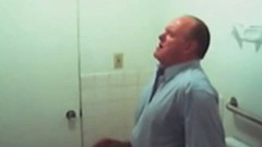 public toilet video: Chubby mature guy getting blowjob in the public restroom