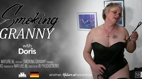 braless video: Horny granny Doris is smoking a sigaret while she's rubbing her pussy