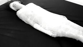 mummification video: Mummified in plastic wrap girl gets fucked and squirts after fingering
