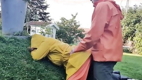 norwegian video: HornyMILF gets filled with huge cock wearing rainwear and pvc boots outdoor