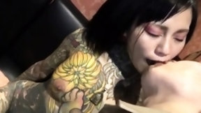 tattoo video: Tattooed Asian babe with small tits has a passion for cock