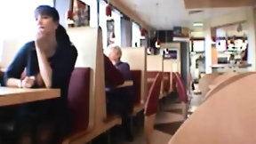 restaurant video: Dark haired chick flash tits in public restaurant