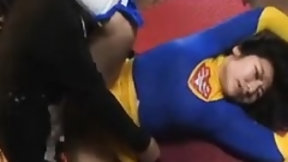 superhero video: Asian babe in a superhero costume is tied down for a rough