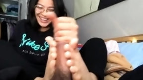 asian footjob video: Nerdy Asian camgirl reveals her amazing footjob talents