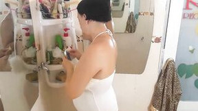 lotion video: Nice Lady into the Shower Room Strokes Cosmetic Grind Lotion Oil on her Amazing Legs. Webcam one-two