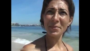 public video: Tanned cougar was picked up on a public beach for kinky sex and a facial