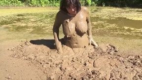 mud video: Sexy adian sinks in clay