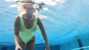 swimming video: Well-shaped MILF is filming herself with selfie stick in the swimming pool