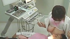 dentist video: Vicious Japanese Dentist Jerks Off Her Clients While They Suck Her Big Jugs